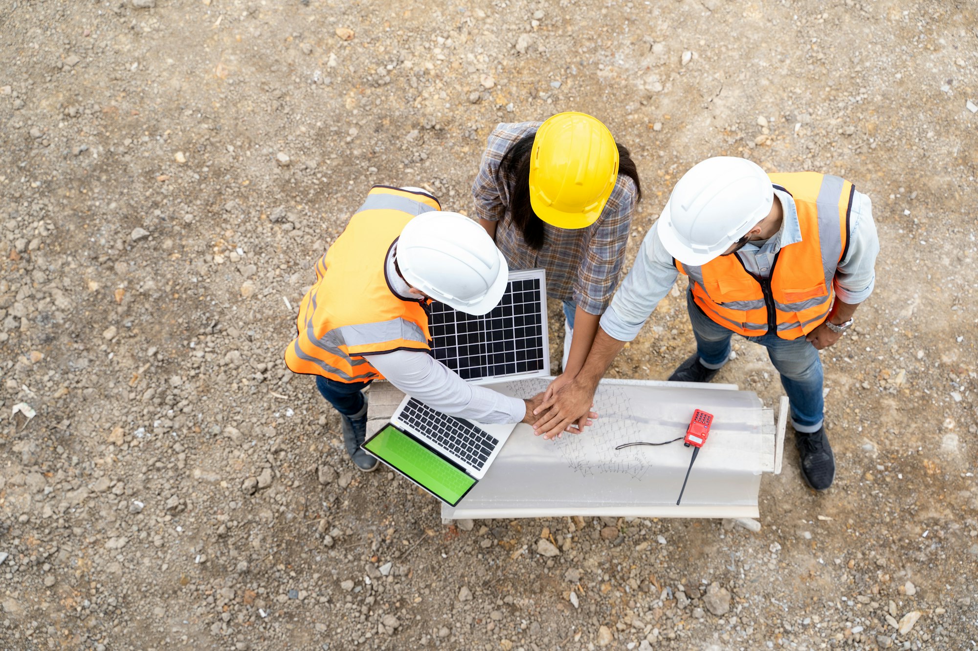 Aerial view Group of builders in working uniform are discussion with consultants.